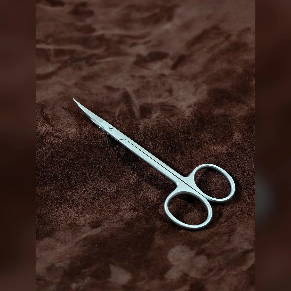 Iris Scissors Plain, Single-Use by Morbella Instruments — diagonal view, closed, photographed at the Sialkot workshop