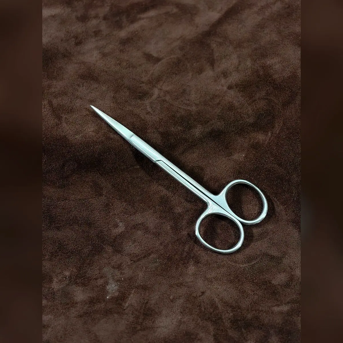 Iris Scissors Round, Single-Use by Morbella Instruments — diagonal view, photographed at the Sialkot workshop