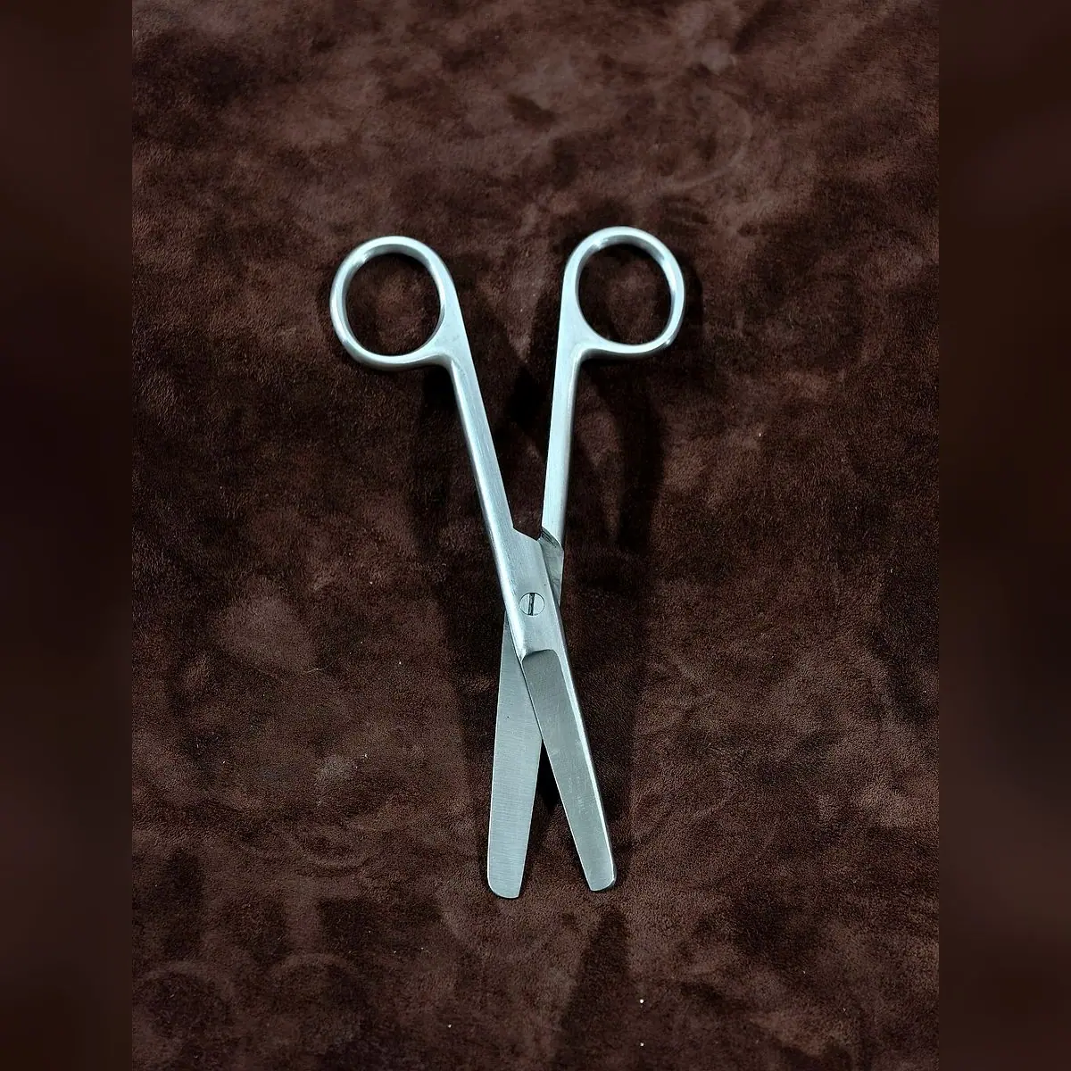 Operating Scissors Blunt/Blunt by Morbella Instruments — blades open, diagonal, photographed at the Sialkot workshop