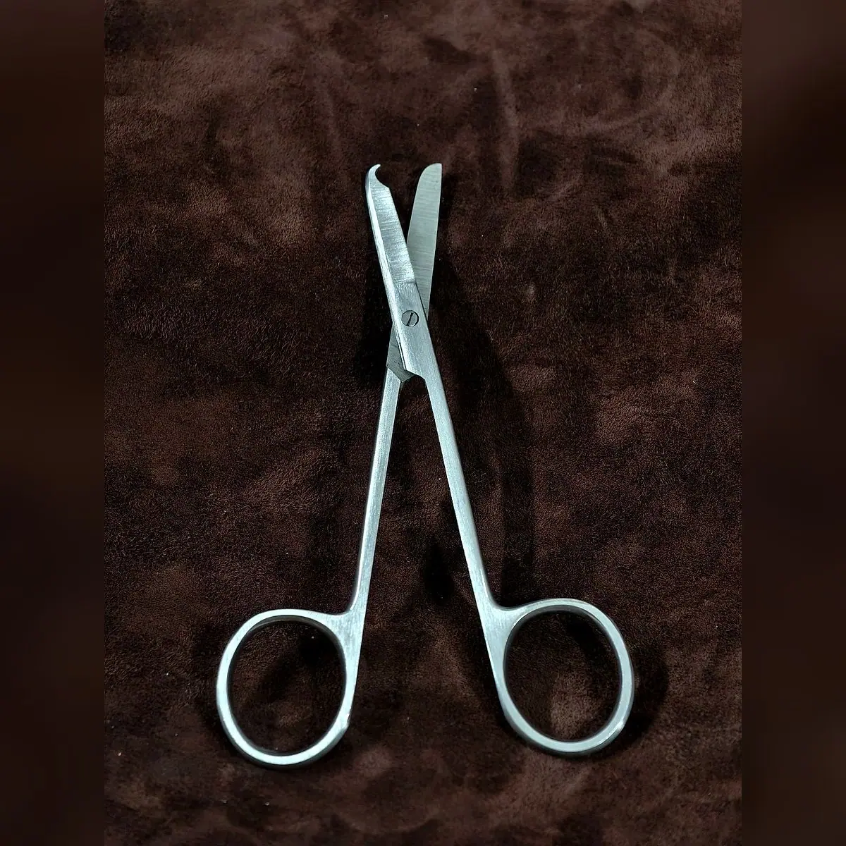 Stitch Scissors, Single-Use by Morbella Instruments — blades open — hooked blade, photographed at the Sialkot workshop